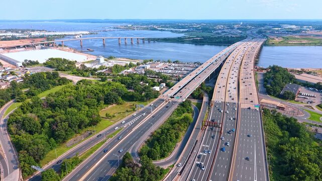 Panoramic aerial view of a major highway junction and bridges in New Jersey, USA. The massive multi-lane complex with hectic traffic on.