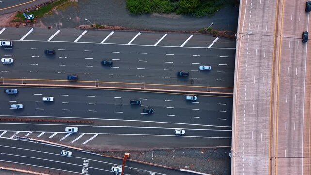 Asphalt multi-lane highways with fast moving cars. Top view. Footage from drone over the motorways from drone.