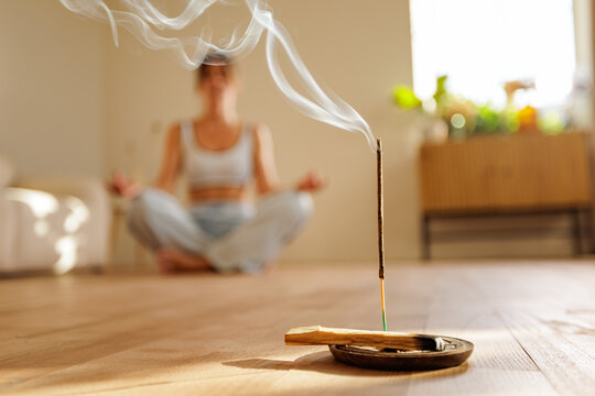 Natural incense stick burning during home meditation for mental balance