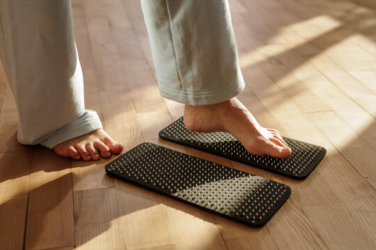 Woman Practicing Sadhu Board Nail Meditation For Stress Relief At Home