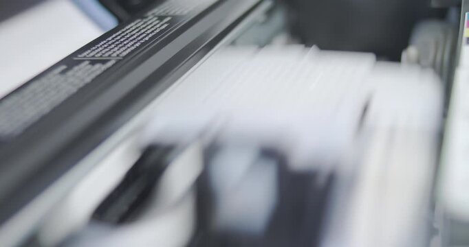 Close up detail of inside working printer while printing