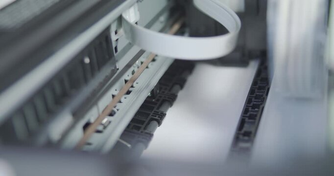 Close up detail of inside working printer while printing