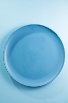 White big size, empty flat plate isolated on a white background.