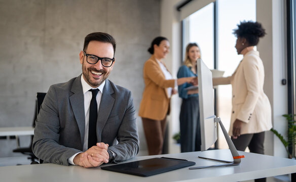 Portrait of successful multicultural business team working in corporate business office