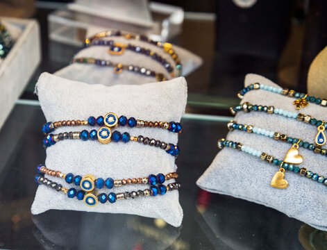 Greek souvenir - amulet bracelets on the hand