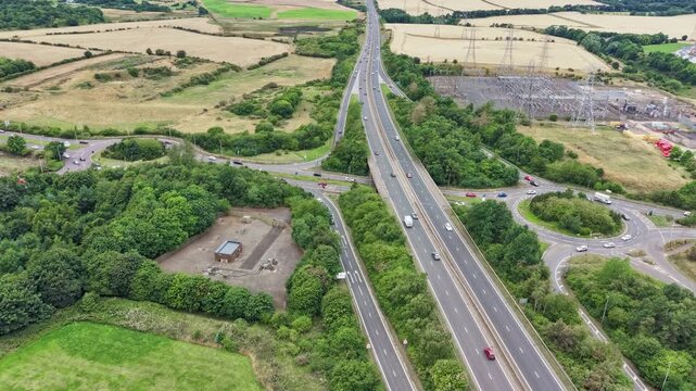 Aerial timelapse of highway traffic at Straiton Junction roundabouts on A720 Edinburgh City Bypass, Scotland