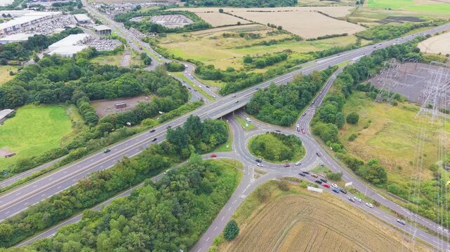 Flyover shot of highway roundabouts and junction interchange at Straiton in Edinburgh, Scotland