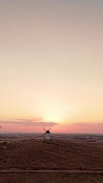 Don quixote windmills on a hill at sunset in alcazar de san juan