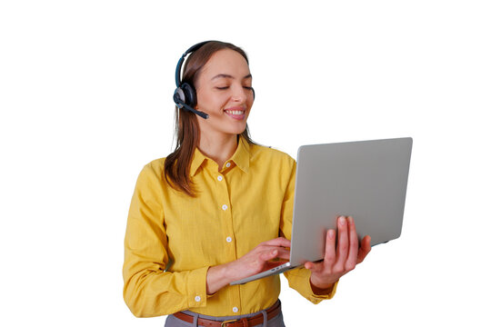 Woman wearing headset and using laptop, providing customer support, remote assistance, and online service with a smile