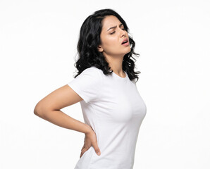Fototapeta premium Young Indian woman experiencing intense lower back pain and severe lumbar discomfort for physiotherapy chiropractic orthopedic healthcare wellness and pain management