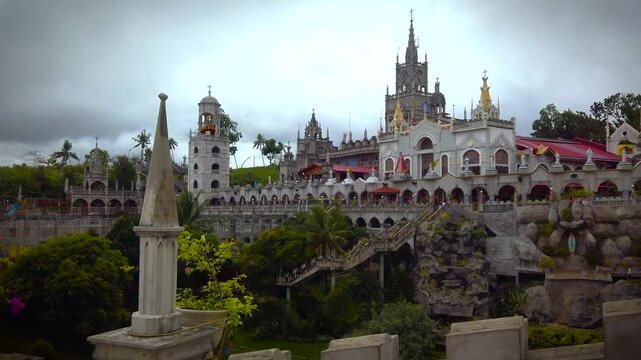 Simala Shrine - Cathedral Towers and Garden -  - Catholic Church and Monastery of Holy Eucharist in Sibonga Village - Cebu City Region - Philippines Landmarks - Cloudy Day - LS MS 4K UHD