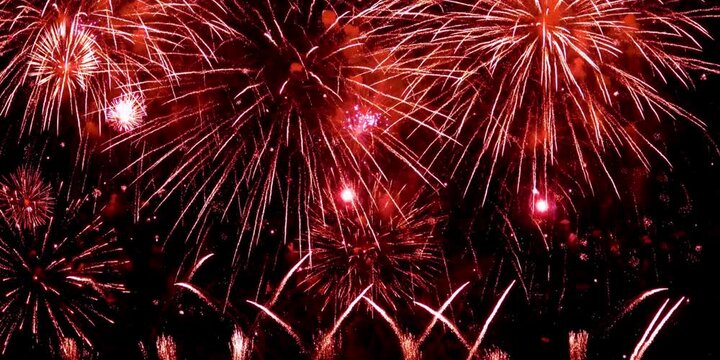 4K long shot 42s. real shining fireworks for celebration background. large golden glowing firework during new year's eve countdown festival in the sky display at night with colorful. Colorful firework