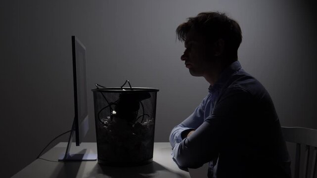 Man breaking free from gaming addiction, discarding a video game controller and cables into a trash can, symbolizing a lifestyle change and new discipline