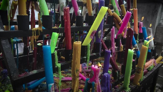 Simala Shrine - Burning Colourful Pray Candles - Catholic Church and Monastery of Holy Eucharist in Sibonga Village - Cebu City Region - Philippines Landmarks - Rainy Day - CU 4K UHD