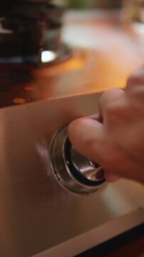 Close-up of a gas stove control knob.