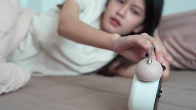 Shocked Asia young woman looking at clock alarm, lady is late appointment or work or class study, overslept, difficulty get up in mornings, time worried, not on time, sleepy, over due, Hurry up time