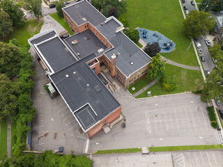 Mt Vernon school building and empty parking lot from above © contentzilla