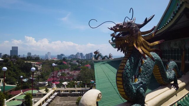 Cebu Taoist Temple - Pagoda Roof Dragon and City Landscape Panorama - Philippino Chinese Community Shrine Complex -  MS LS 4K UHD