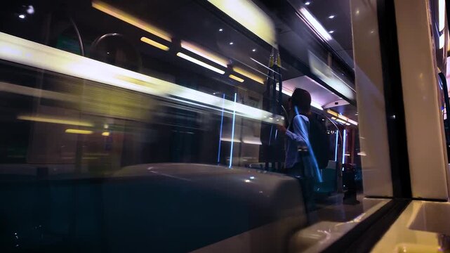 Metro Train Car Fast Passing Underground Tunnel with Colourful Light Reflections On Window Glass - MS 4K UHD