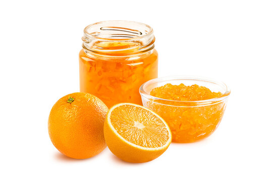 Collection of orange jam in glass jar and bowl, paired with fresh oranges and slices on white background. Perfect for breakfast, bakery, and healthy food design concepts.