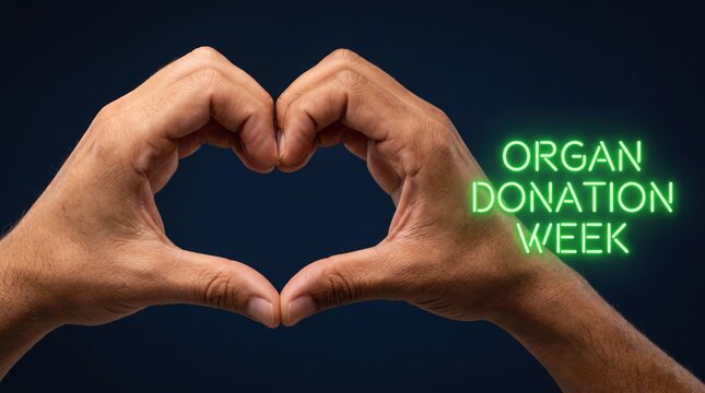 Two hands forming a heart shape against a dark blue background with glowing green text reading o r g a n d o n a t i o n w e k