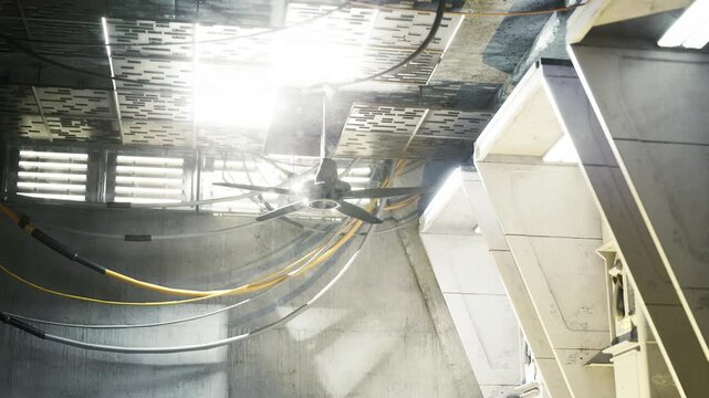 Sundrenched atrium with soaring columns and strong vertical light, bright beams create airy yet industrial mood, great for architectural concepts or editorial