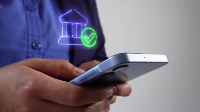 Secure finances. Businesswoman with smartphone in hand displaying a virtual bank icon with a shield and a checkmark.