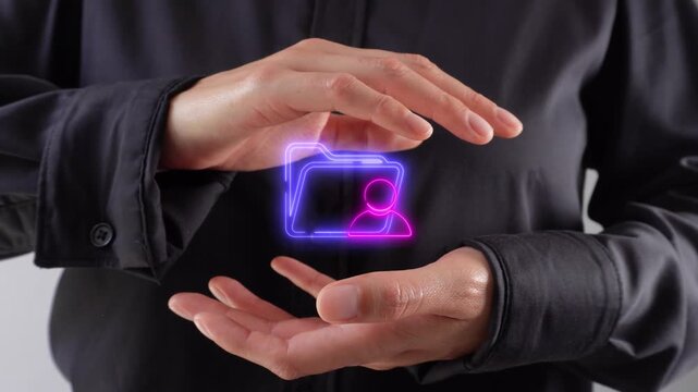 Organization of digital profiles. Close-up of a pair of women's hands cupping a virtual folder icon featuring a personal avatar.