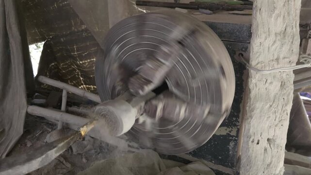 Traditional Artisan Making Granite Stone Utensil on Lathe Machine, Handcrafted Stone Bowl Manufacturing, Indian Stone Craftsmanship, Natural Granite Carving, Traditional Industry and Skilled Artisan