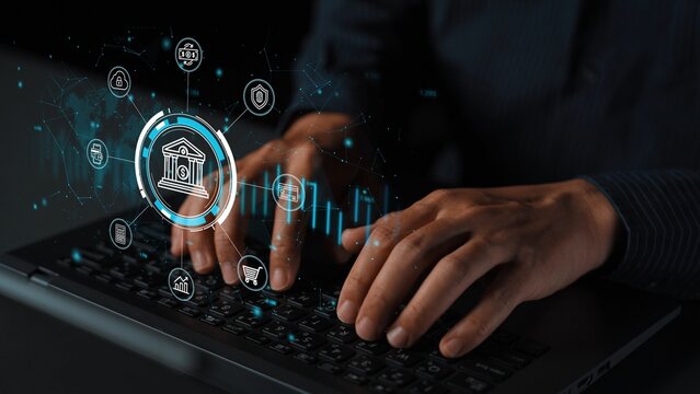 Person typing on laptop with banking icons overlay showcasing digital finance technology and data analysis in a modern workspace environment. Entropy.