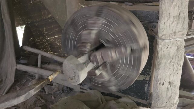 Traditional Artisan Making Granite Stone Utensil on Lathe Machine, Handcrafted Stone Bowl Manufacturing, Indian Stone Craftsmanship, Natural Granite Carving, Traditional Industry and Skilled Artisan