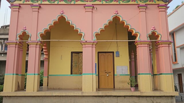 Sri Gopinath Gaudiya Math Temple in Mayapur, West Bengal, India, Peach-Colored Hindu Temple Facade with Ornate Domes and Traditional Architecture, Spiritual Pilgrimage and Religious Heritage