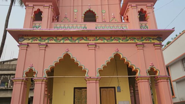 Sri Gopinath Gaudiya Math Temple in Mayapur, West Bengal, India, Peach-Colored Hindu Temple Facade with Ornate Domes and Traditional Architecture, Spiritual Pilgrimage and Religious Heritage