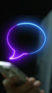 Businessman holding smartphone vertical shot displaying glowing chat speech bubble quote frame overlay. Customer feedback testimonial, online message conversation, and dialogue template concept.
