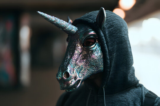 a man dressed in a mask featuring a unicorn