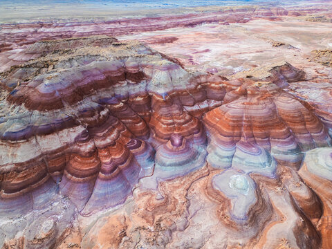 Aerial shot of the rainbow Bentonite Hills near Hanksville, Utah. Abstract background, landmark, travel destination