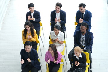 Fototapeta premium Top view successful business group of multiethnic people meeting,Communication Training, Discussing office Organization, Event Management Business. Business Team Meeting in Modern Office Workplace.