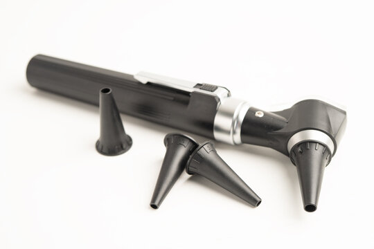 Otoscope with model for audiologist or ENT doctor use otoscope checking ear and treat hearing loss problem.