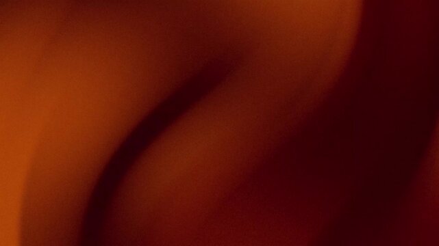 Abstract warm brown and dark orange gradient wave background with soft flowing light and smooth curve