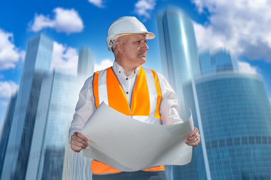 Construction engineering. Civil engineer reviews architectural plans for a high-rise development, supervising commercial building design, planning and urban construction projects.
