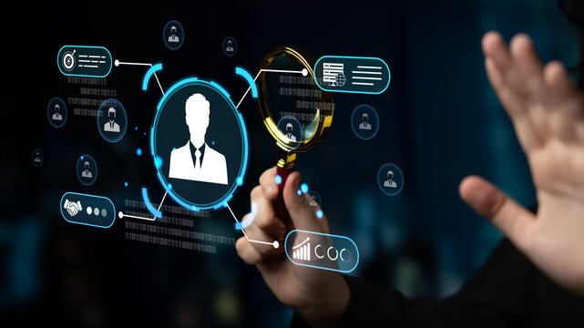 Professional analyzing digital data with virtual magnifying glass in a modern tech environment showing user profiles and statistics behind. Sentient.