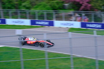 Fototapeta premium May 24, 2025, Montreal, Canada, Charles Leclerc drives Ferrari F1 car at Circuit Gilles Villeneuve. g.