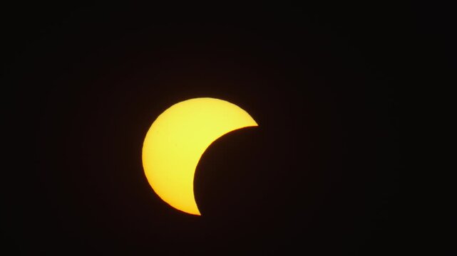 Aerial view of solar eclipse visible in the dark sky over Krakow, Lesser Poland Voivode, Poland.