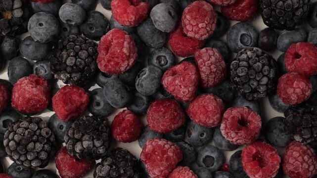 Frozen mixed berries moving close up