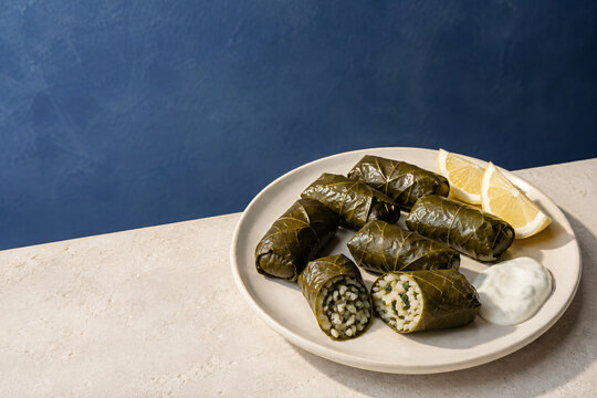 Greek Dolmades Stuffed Grape Leaves with Rice, Herbs and Lemon

