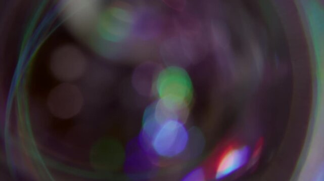 Blur circle. Color reflection. Defocused blue red lens flare flicker beam gleam on abstract with bokeh effect dark black background.