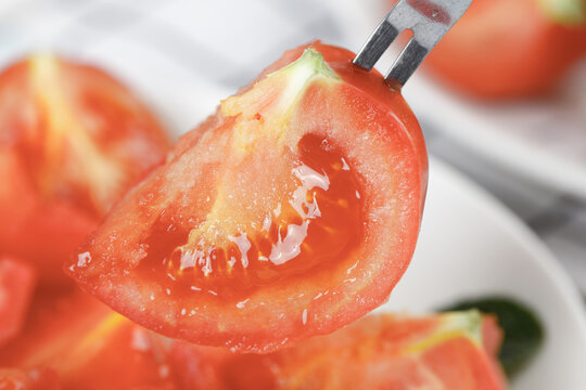 Fresh Tomato Slice on Fork - Juicy Red Vegetable Close-up