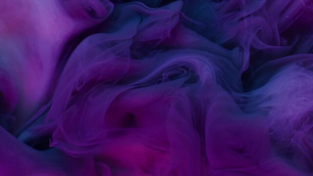 Ink fluid. Fume water. Defocused purple pink blue colorful cloud texture splash acrylic vapor spreading on abstract art background.