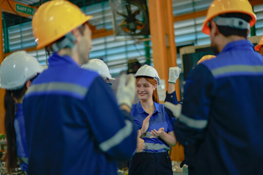 Female industrial plant engineering workers attended the meeting along with their technical colleagues and managers, displaying energetic and engaged demeanor.