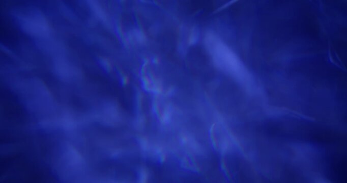 Defocused illuminated light. Radiant reflection. Cold blue color rainbow gleam flare optical texture on abstract luminous art background.
